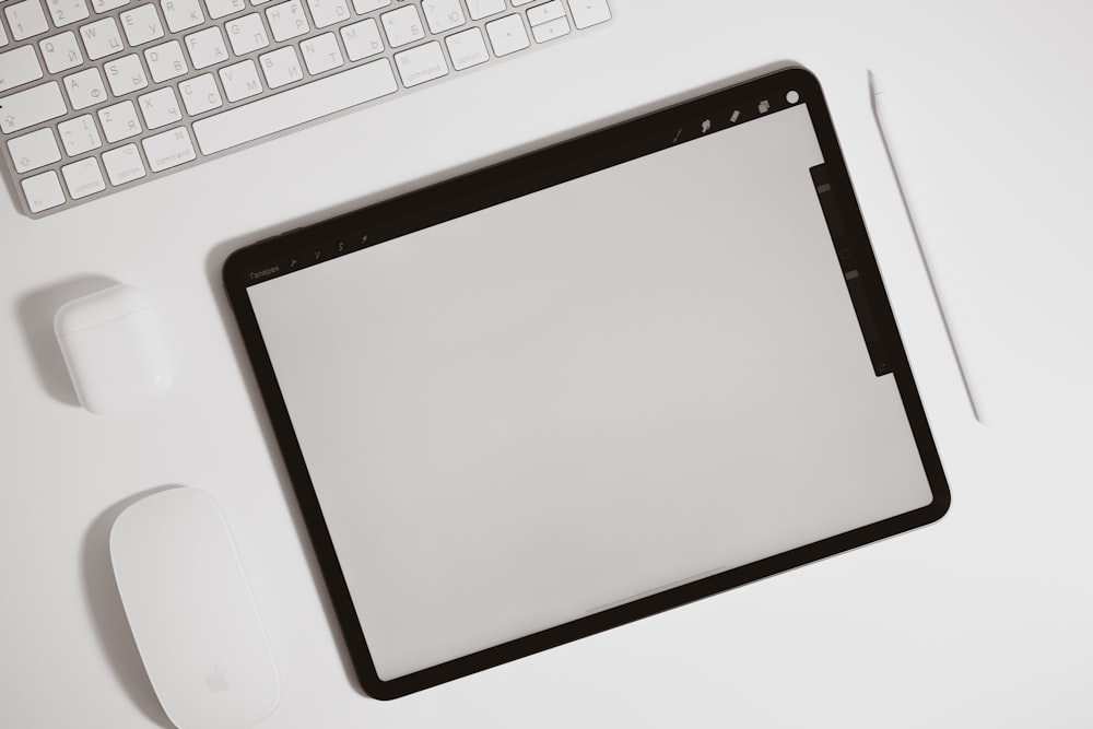 black ipad on white table