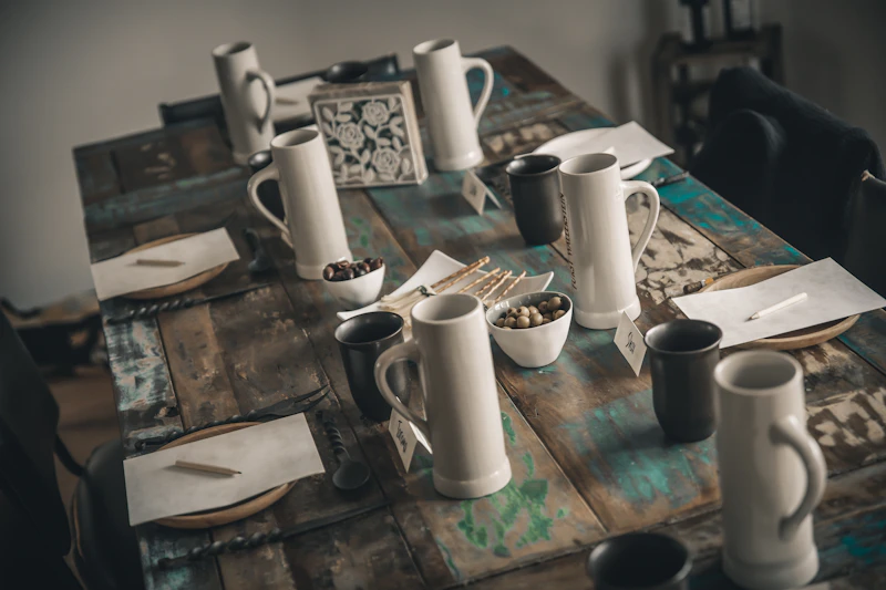 White and black ceramic mugs on a table