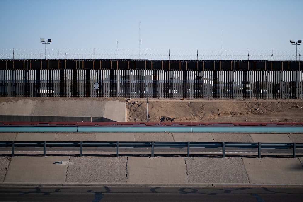 brown and blue metal fence