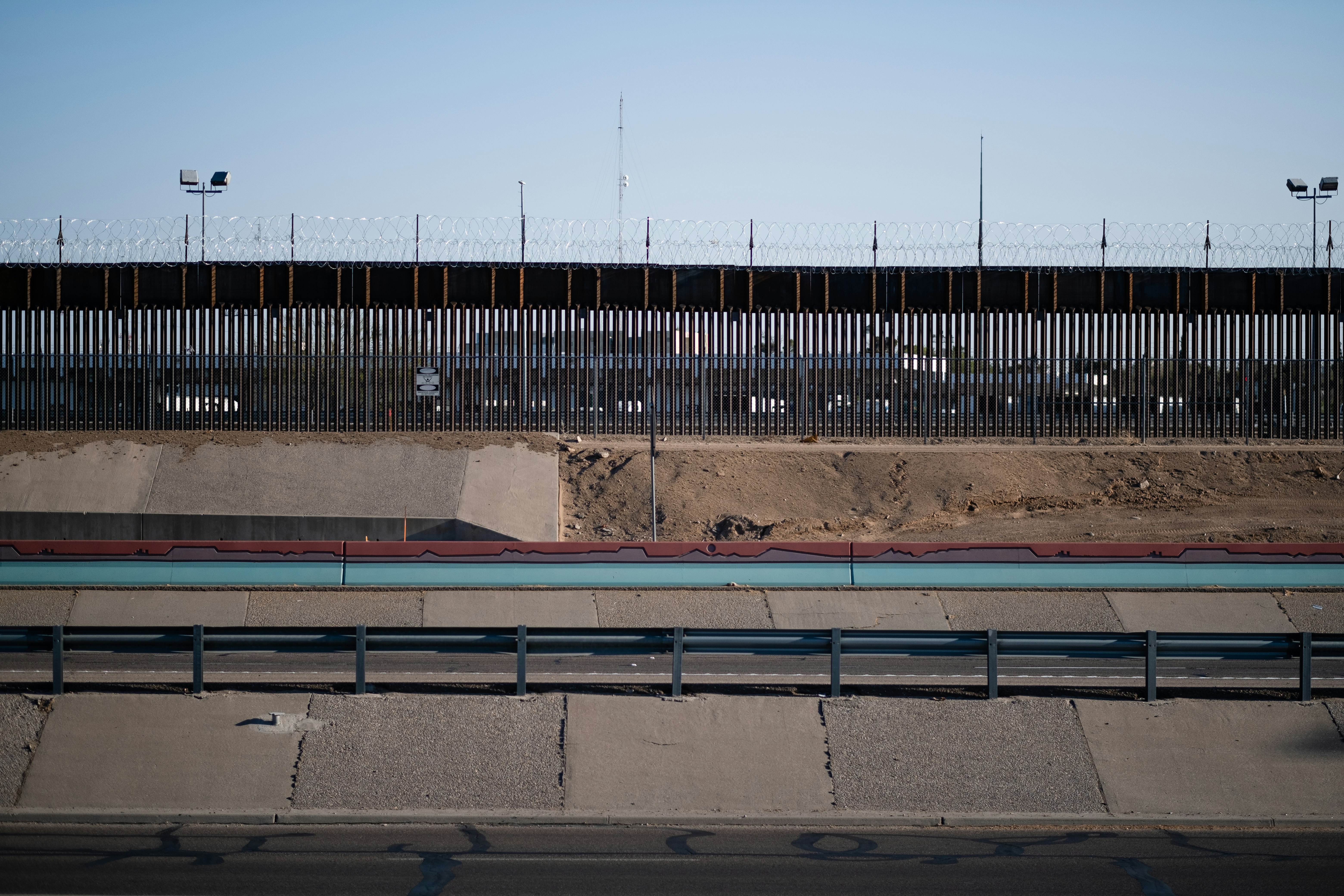 brown and blue metal fence