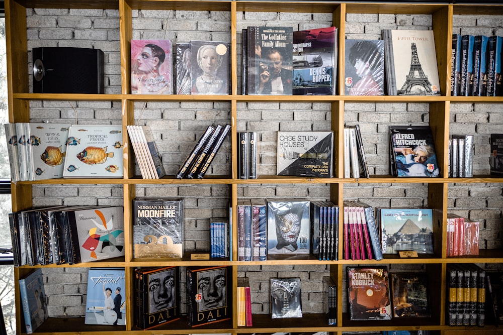 books on brown wooden shelf