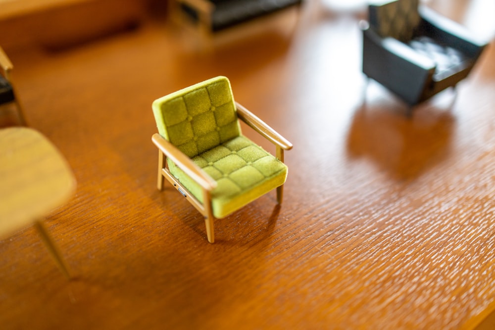 green wooden chair on brown wooden table