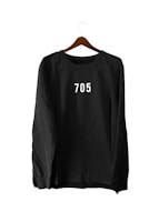 A cozy hoodie with a personalized name and logo printed on the chest, hanging on a rustic hook.