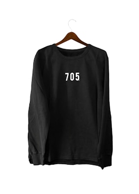 A black sweatshirt with the number '705' printed in white on the chest, hanging on a wooden hanger against a white background.