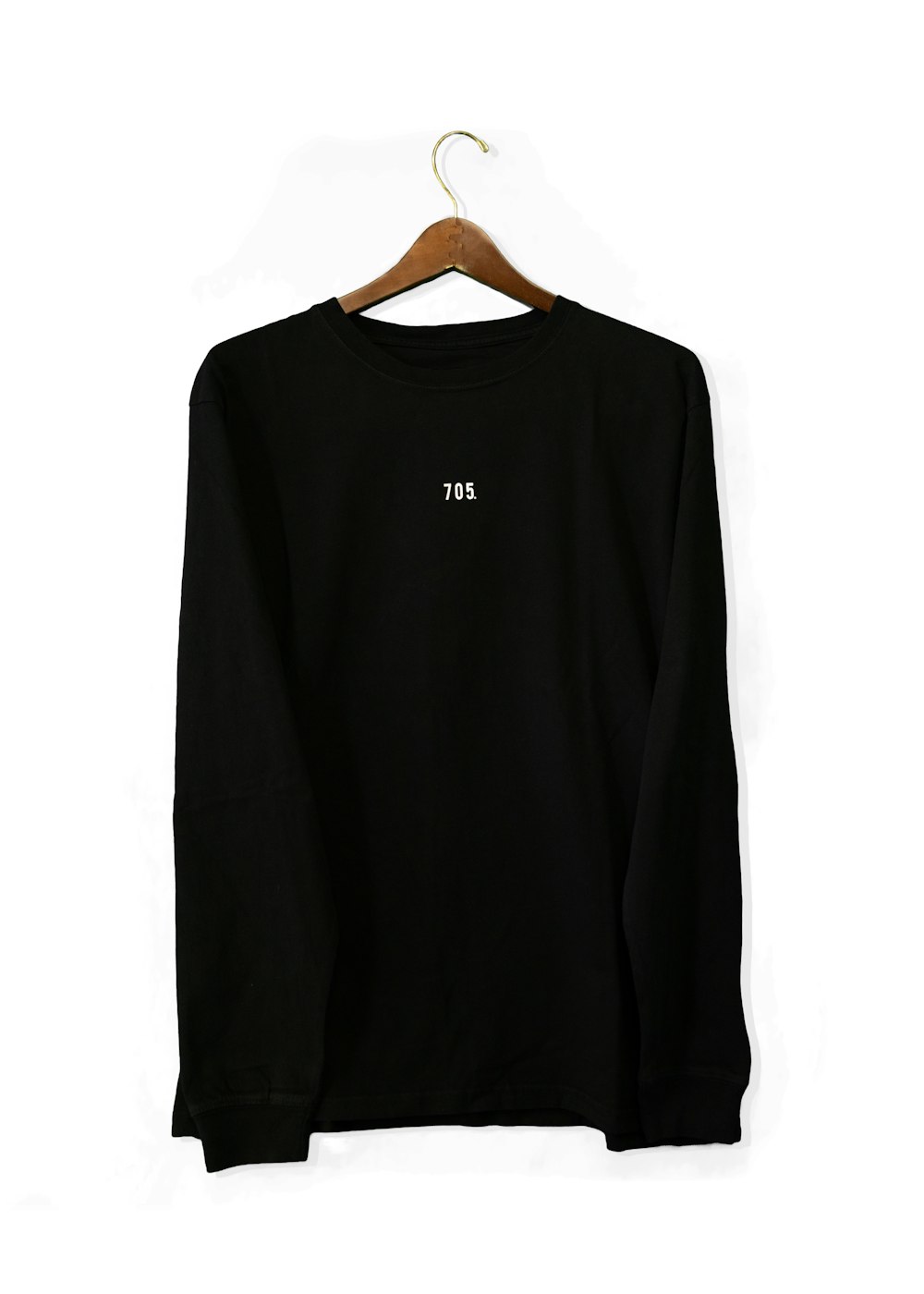 black long sleeve shirt on white table