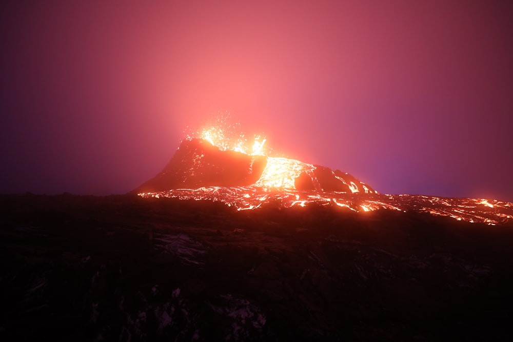 silhouette of mountain during night time