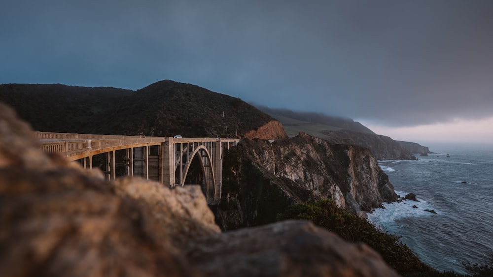 gray concrete bridge over the river