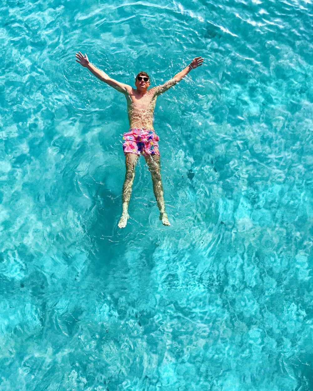 woman in blue and white bikini in water