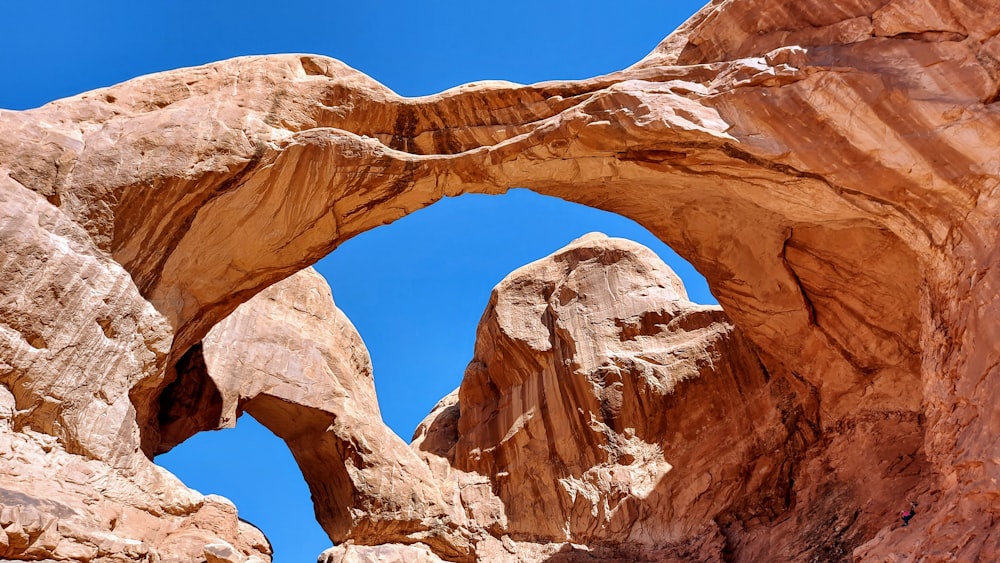 brown rock formation under blue sky during daytime