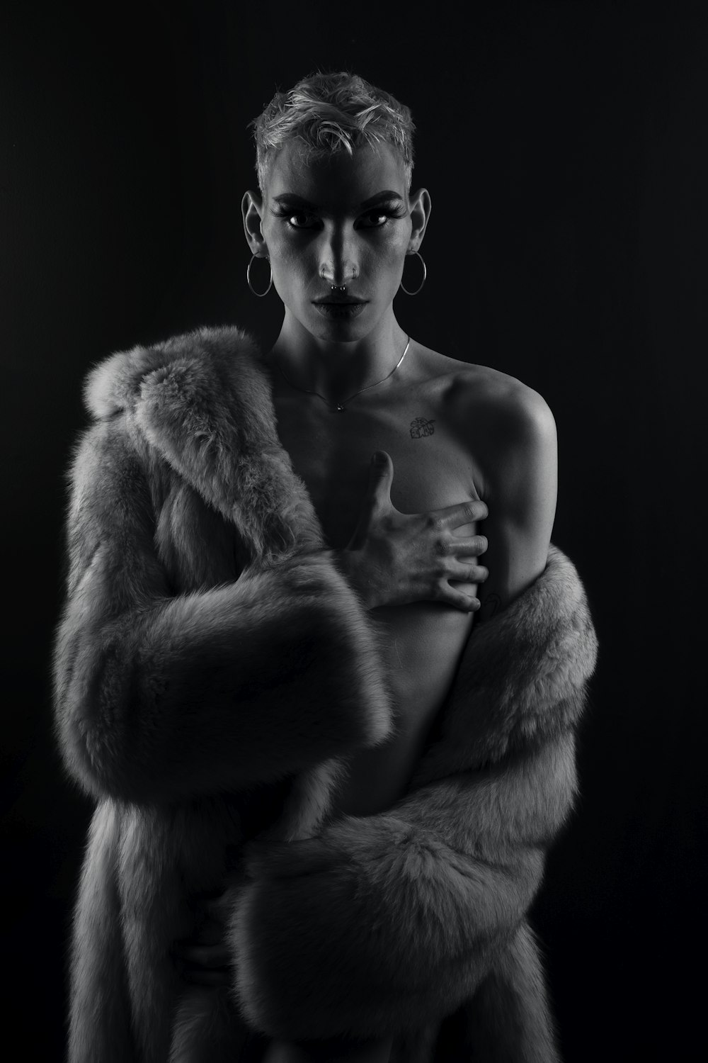 topless man with fur coat