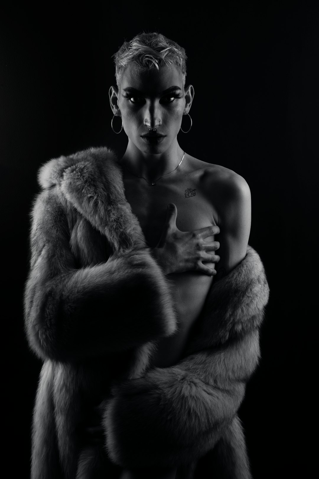 topless man with fur coat