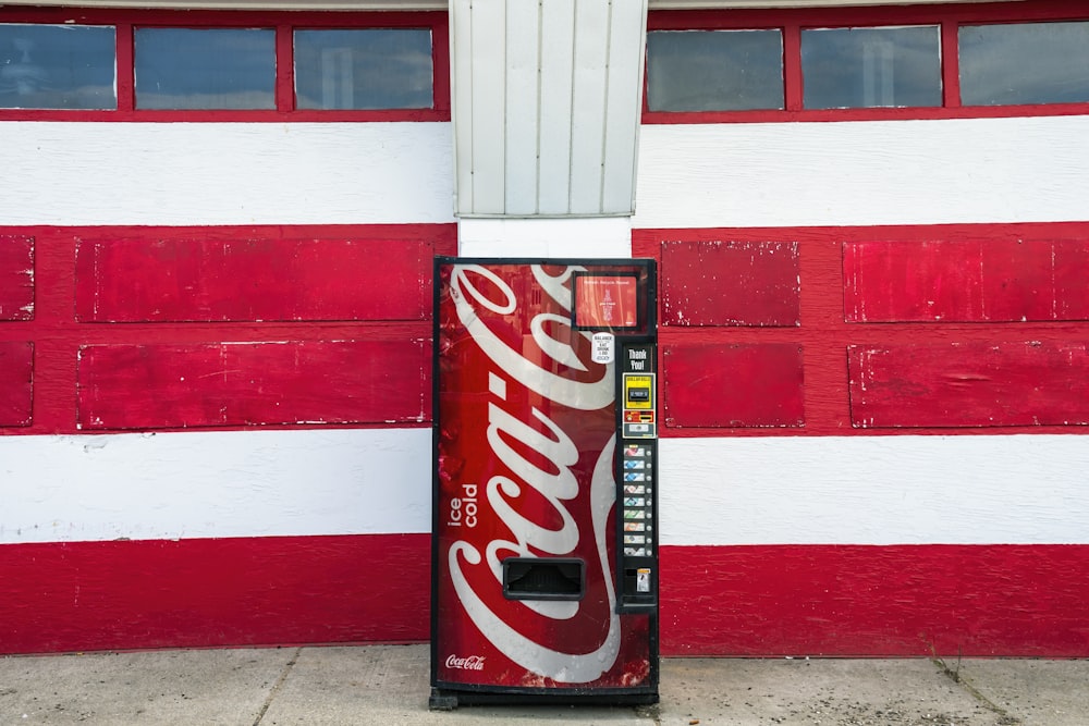 coca cola zero can on red and white wall
