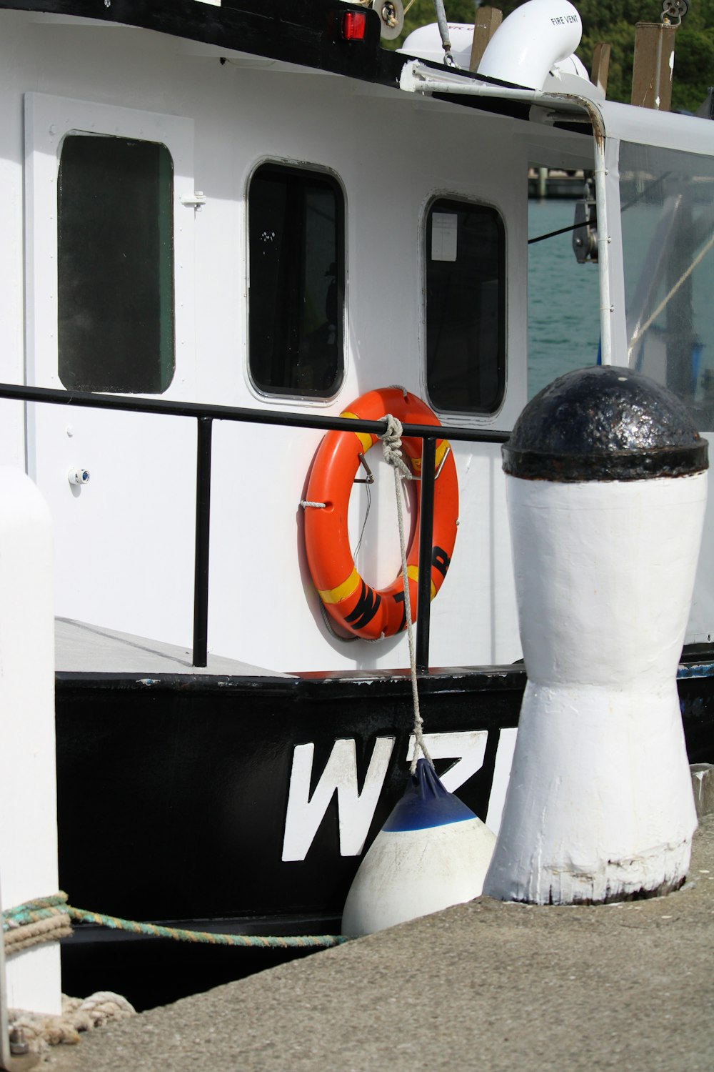 orange and black nike bag on white and black boat