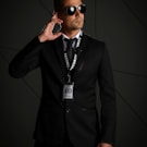 man in black suit wearing black sunglasses