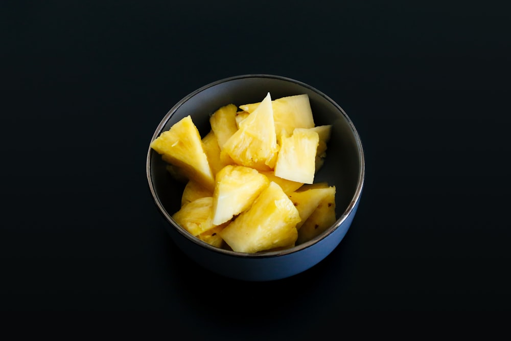 sliced fruit in blue ceramic bowl