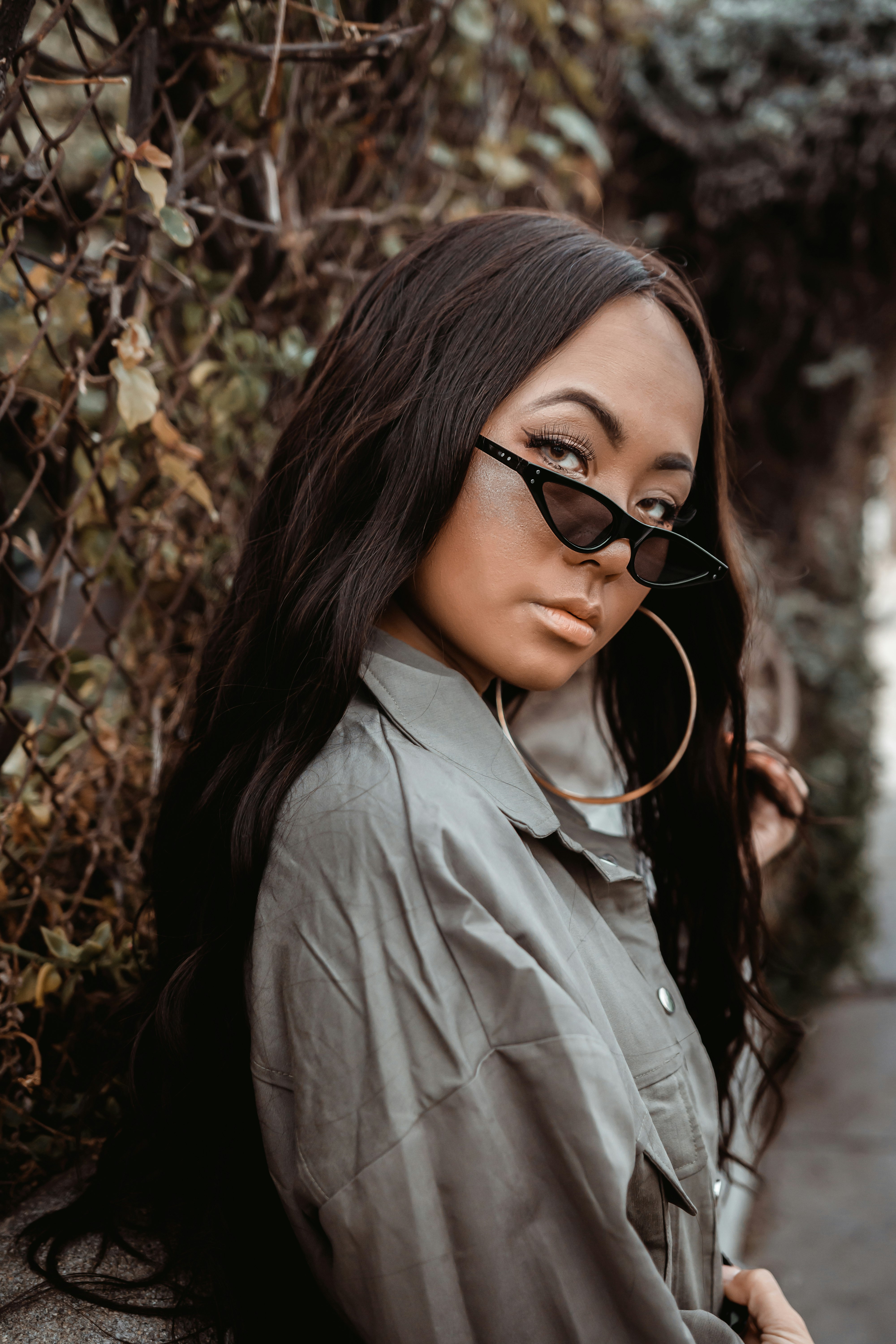 woman in white button up shirt wearing black framed eyeglasses