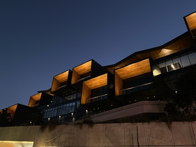 A modern building showcasing architectural design elements at sunset.
