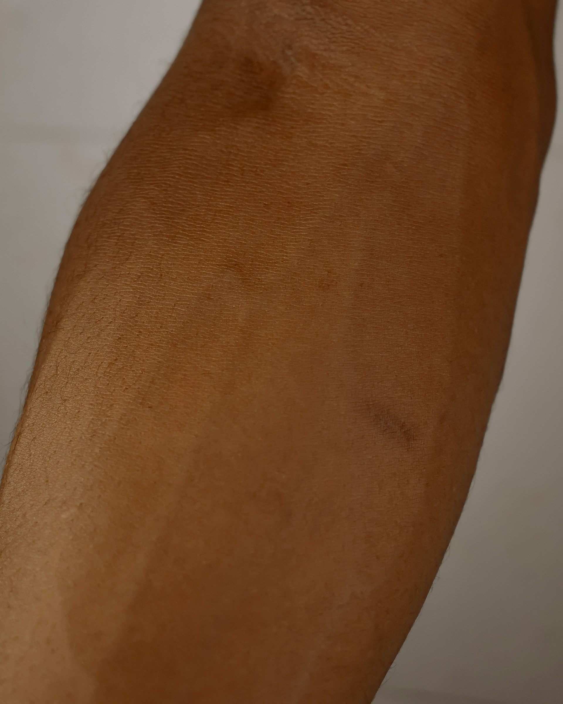 woman wearing yellow long-sleeved dress under white clouds and blue sky during daytime