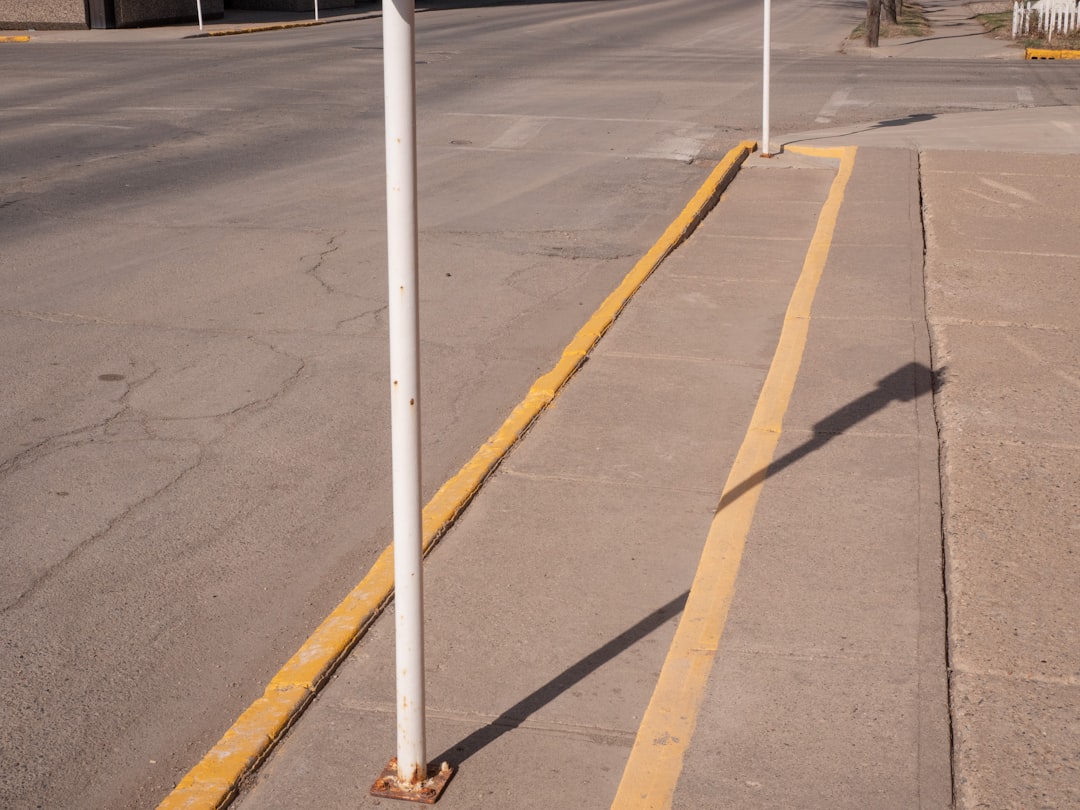 white and yellow line on gray asphalt road