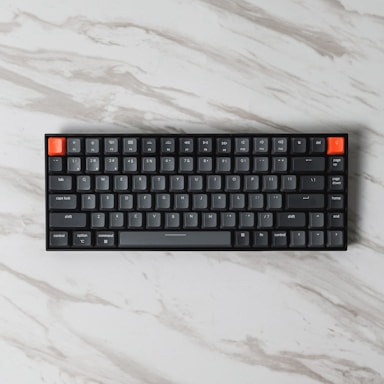 black and orange computer keyboard