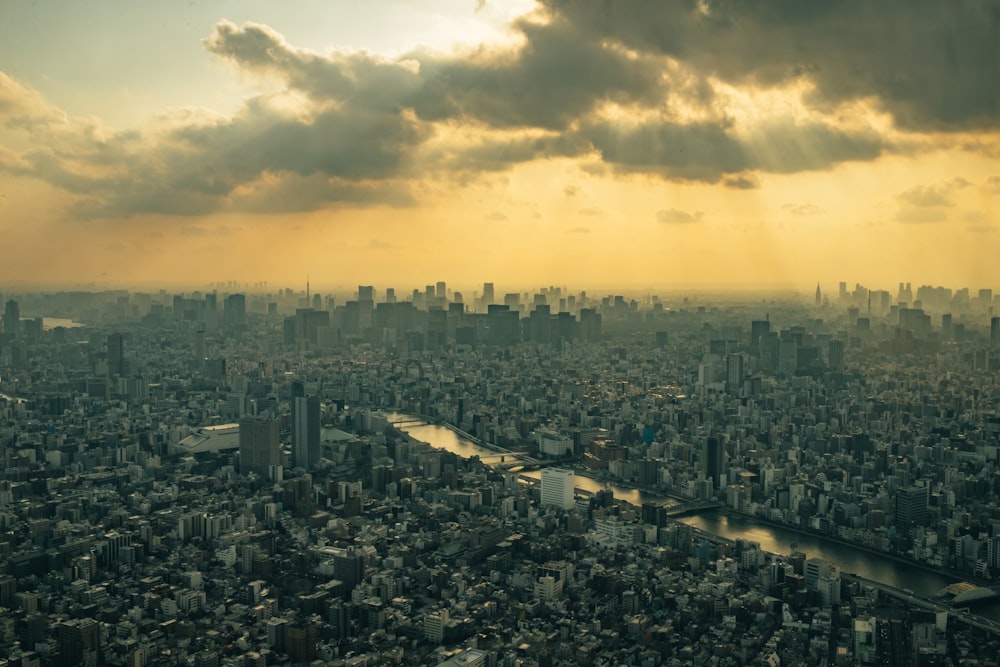 city skyline under cloudy sky during daytime