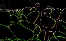 Abstract visualization of a connected influencer network glowing softly in muted gold against a black background.