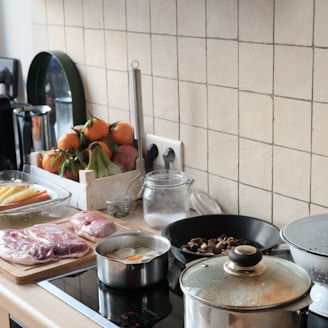 A vibrant kitchen counter with colorful fresh vegetables and a quick-prep meal in progress.