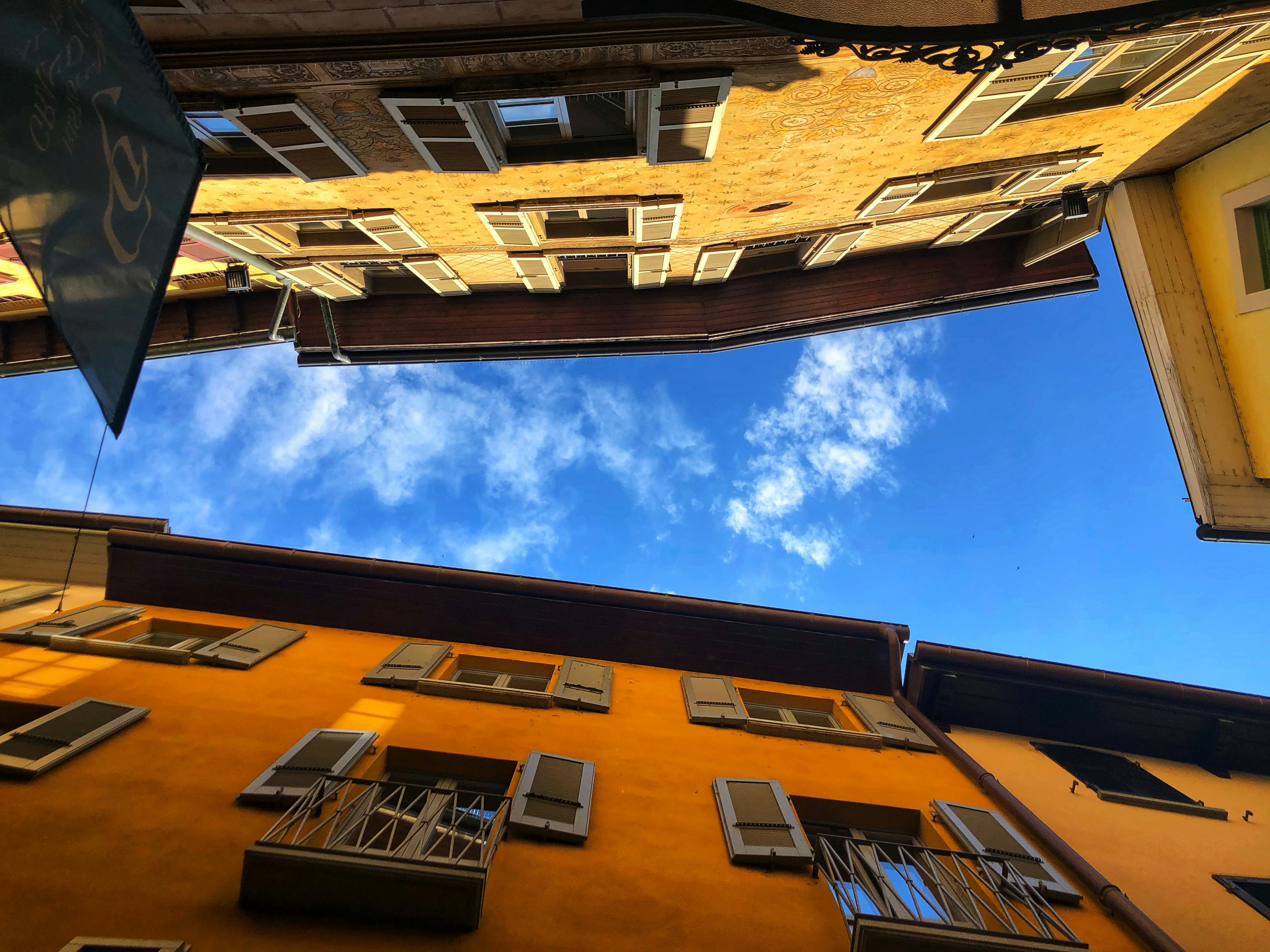 brown and white concrete building under blue sky during daytime