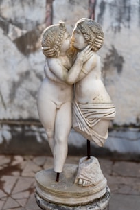 gold human statue during daytime