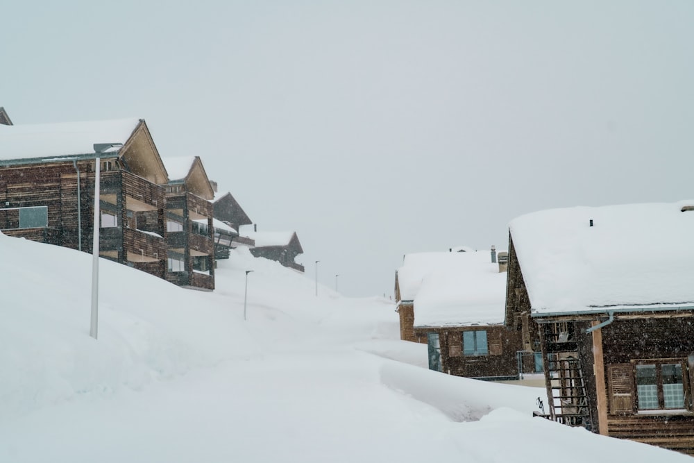 brown and white houses on snow covered ground