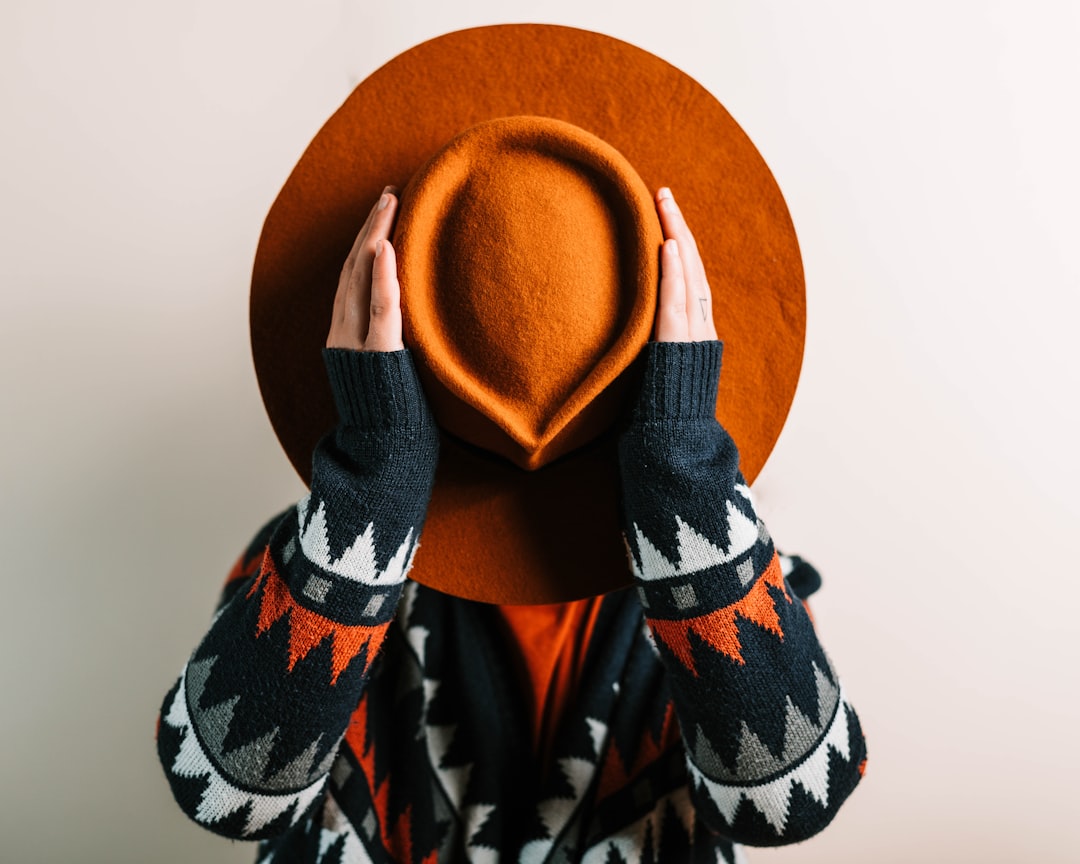 brown hat on white surface