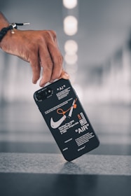 person holding black samsung galaxys 7 edge