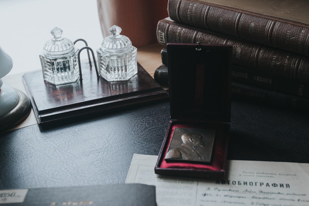 black wooden picture frame on glass table