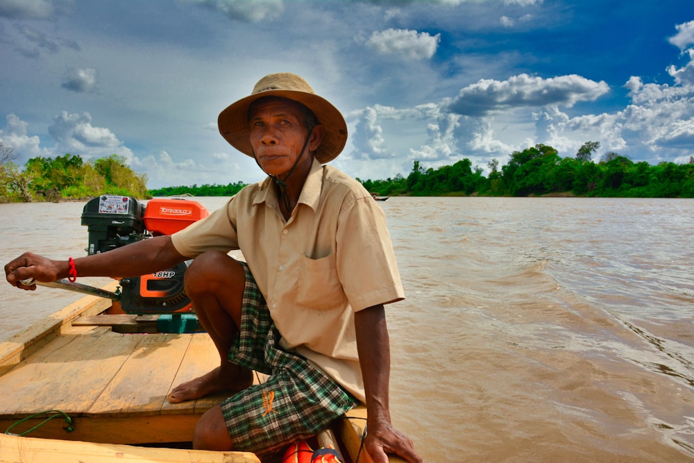 woman in brown button up shirt and red plaid skirt sitting on brown wooden boat on near near near on