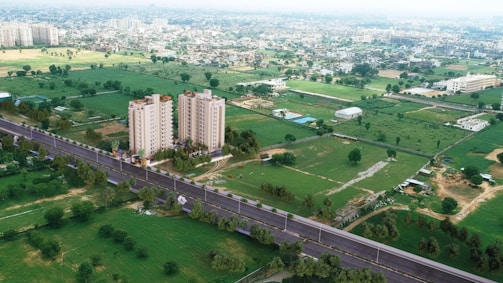 An aerial view of an urban community with mixed housing and green spaces.