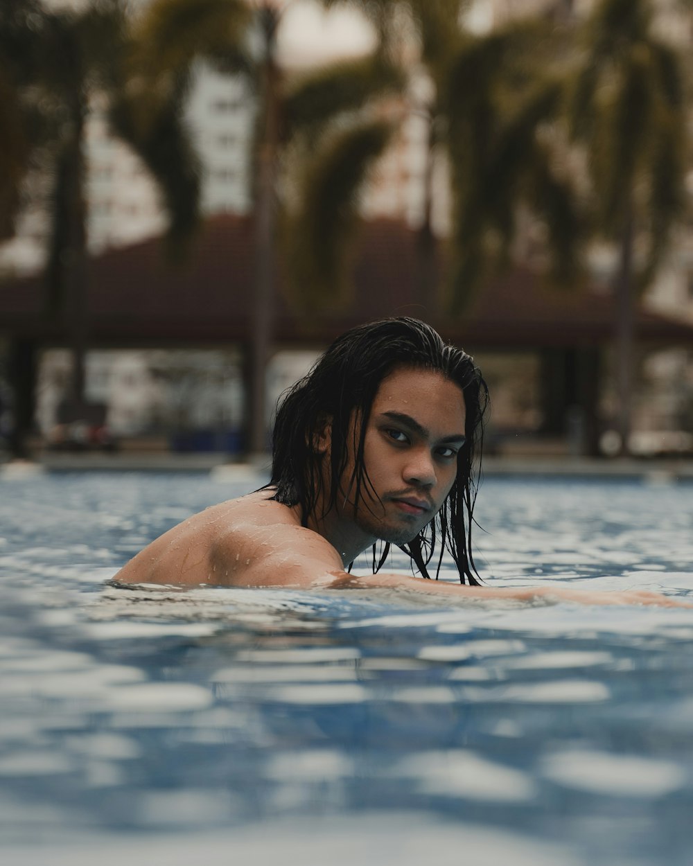 woman in swimming pool during daytime