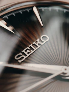 a close up of a clock with the word seiko on it