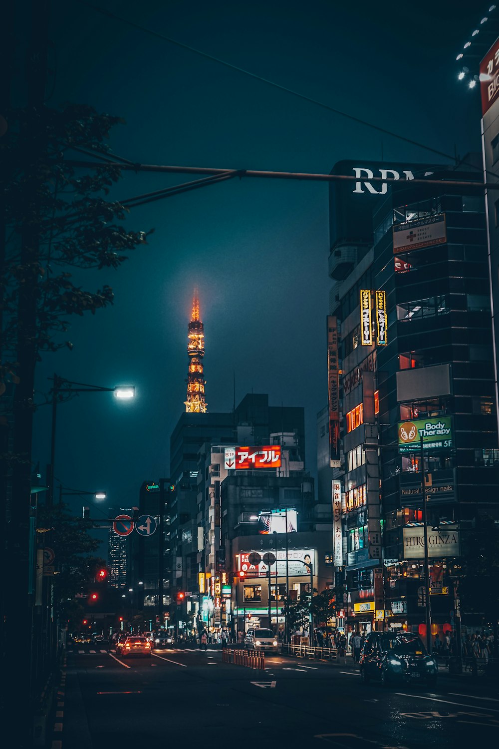 city buildings with lights turned on during night time