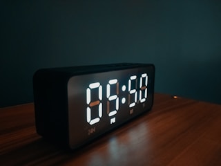 A sleek digital timer interface glowing softly in dark mode on a smartphone screen.
