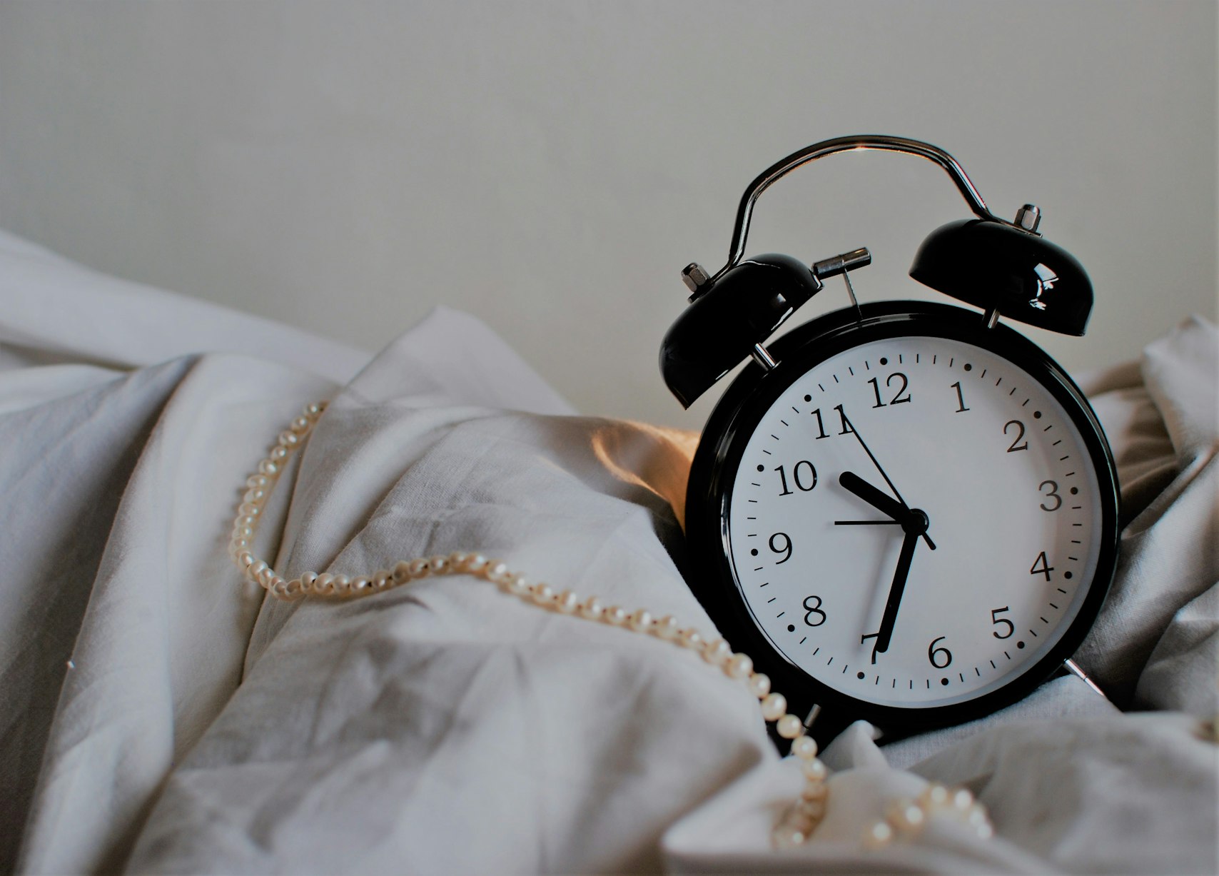 Alarm clock showing consistent bedtime