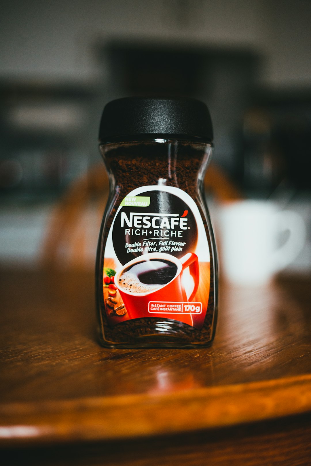 nescafe original coffee bottle on brown wooden table