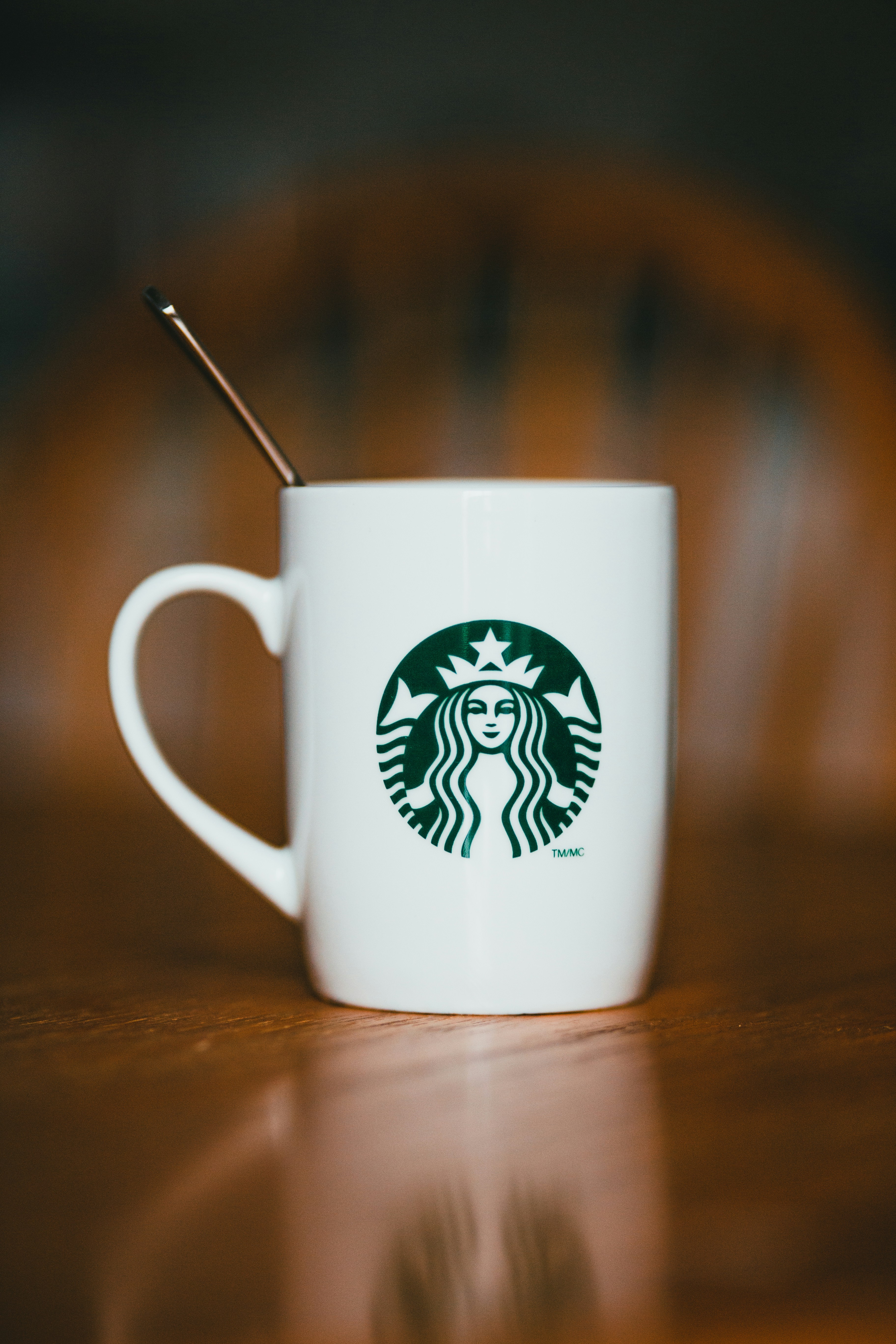 White starbucks ceramic mug on brown wooden table photo  Free Grey Image  on Unsplash