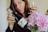 woman in black long sleeve shirt holding wine bottle
