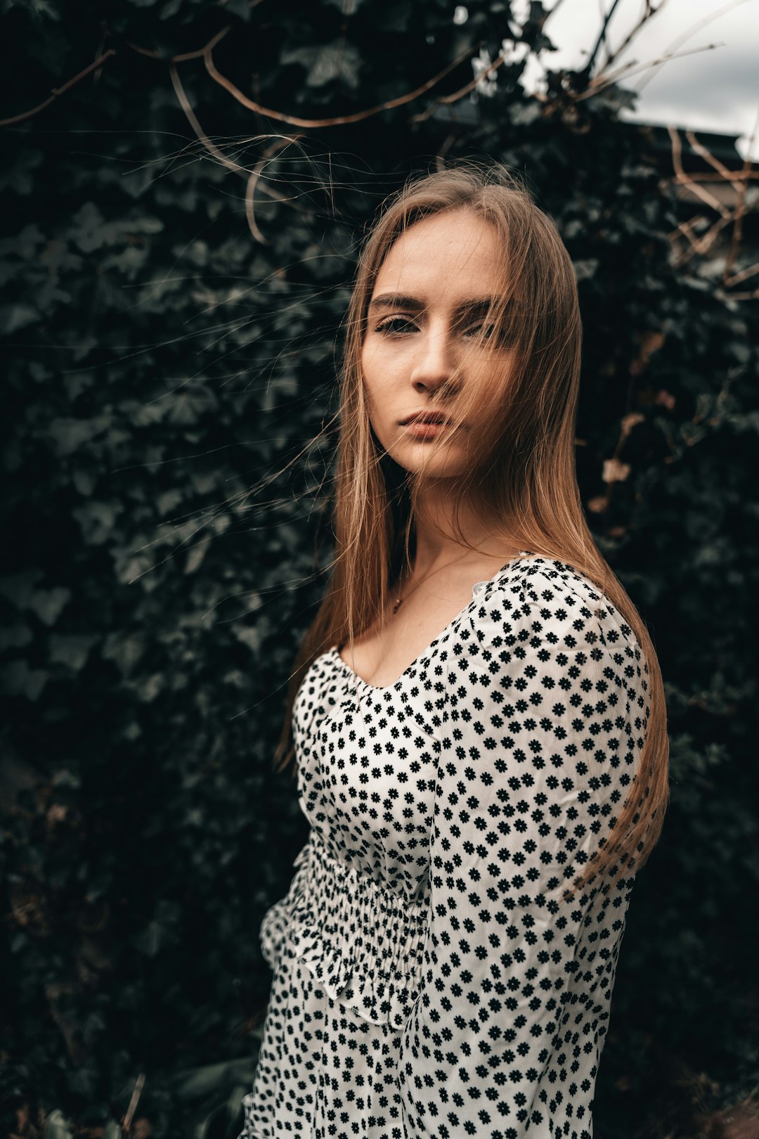 woman in black and white polka dot shirt