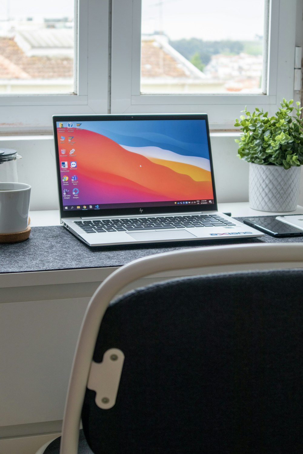 macbook pro on white table