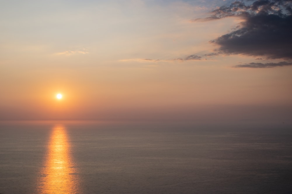 body of water during sunset