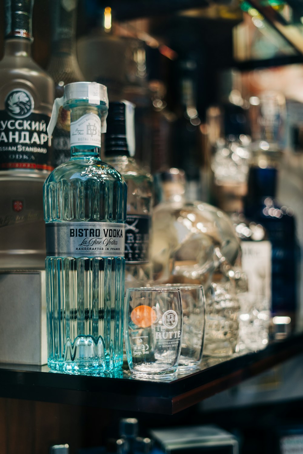 clear drinking glass on glass table