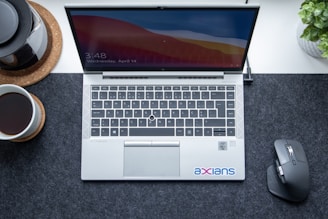 macbook pro on gray textile