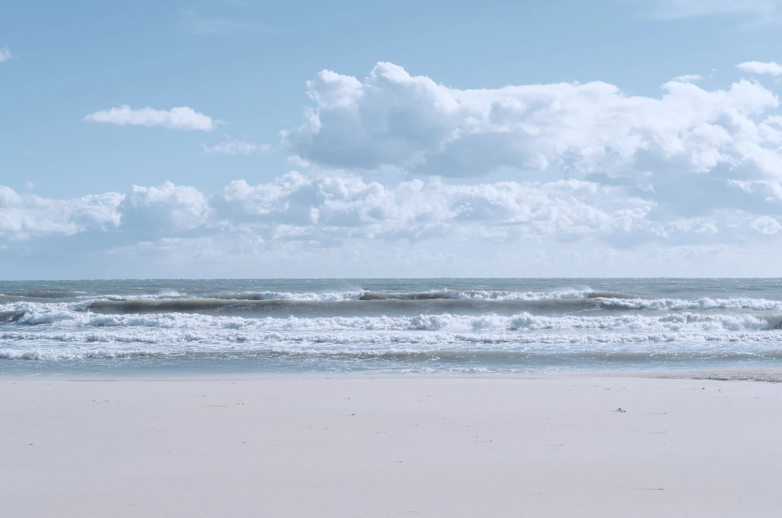 Soft clouds over a calm sea