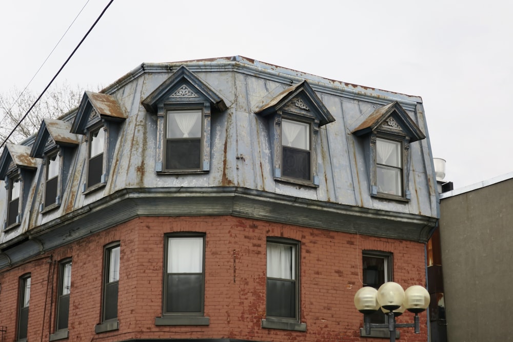 brown brick building with glass windows